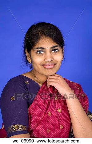 Beautiful Hindu teenager dressed in a traditional Sari dress View Large Photo Image Stock Image - Beautiful Hindu teenager dressed in a traditional Sari dress. Fotosearch