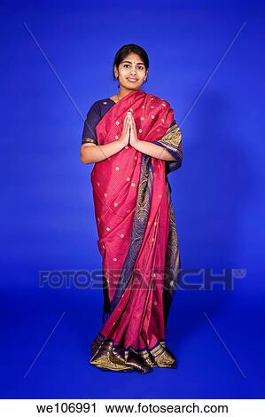 Beautiful Hindu teenager dressed in a traditional Sari dress View Large Photo Image Stock Image - Beautiful Hindu teenager dressed in a traditional Sari dress. Fotosearch
