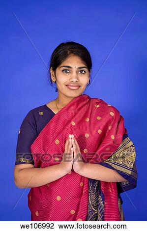 Beautiful Hindu teenager dressed in a traditional Sari dress View Large Photo Image Stock Image - Beautiful Hindu teenager dressed in a traditional Sari dress. Fotosearch