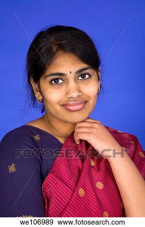 Beautiful Hindu teenager dressed in a traditional Sari dress View Large Photo Image Stock Photo - Beautiful Hindu teenager dressed in a traditional Sari dress. Fotosearch