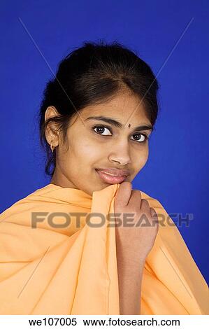 Beautiful Hindu teenager dressed in a traditional Indian dress View Large Photo Image Stock Photography - Beautiful Hindu teenager dressed in a traditional Indian dress. Fotosearch