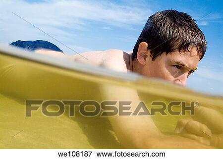 Boy swimming in the sea, Biscarrosse, France View Large Photo Image Stock Photo - Boy swimming in the sea, Biscarrosse, France. Fotosearch