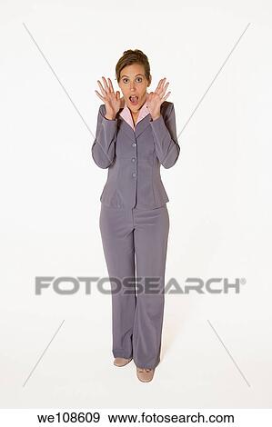 Businesswoman in early 20s standing with a surprised look View Large Photo Image Stock Photo - Businesswoman in early 20s standing with a surprised look. Fotosearch