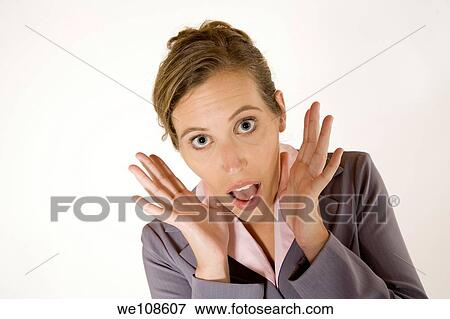 Businesswoman in early 20s with a very surprised look View Large Photo Image Stock Photo - Businesswoman in early 20s with a very surprised look. Fotosearch