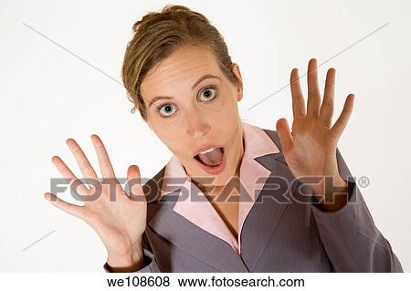 Businesswoman in early 20s with a very surprised look View Large Photo Image Stock Photo - Businesswoman in early 20s with a very surprised look. Fotosearch