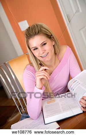 Caucasian college student working on home work View Large Photo Image Stock Photograph - Caucasian college student working on home work. Fotosearch