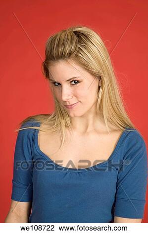 Stock Image - Caucasian woman showing facial expressions in a studio. Fotosearch