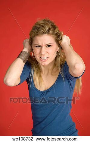 Caucasian woman showing facial expressions in a studio View Large Photo Image Stock Image - Caucasian woman showing facial expressions in a studio. Fotosearch