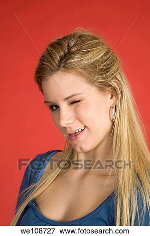 Stock Photo - Caucasian woman showing facial expressions in a studio. Fotosearch