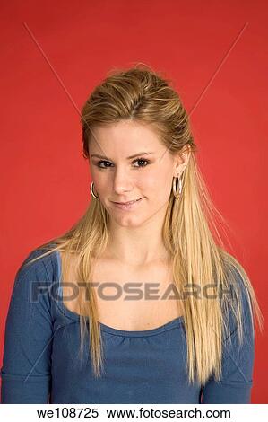 Stock Photography - Caucasian woman showing facial expressions in a studio. Fotosearch