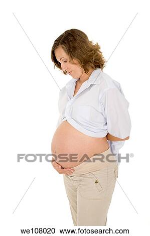 Caucasian woman who is 9 months pregnant on white background View Large Photo Image Stock Image - Caucasian woman who is 9 months pregnant on white background. Fotosearch