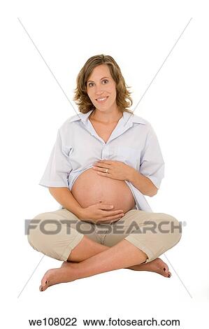 Caucasian woman who is 9 months pregnant on white background View Large Photo Image Stock Image - Caucasian woman who is 9 months pregnant on white background. Fotosearch