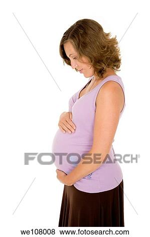 Caucasian woman who is 9 months pregnant on white background View Large Photo Image Stock Photo - Caucasian woman who is 9 months pregnant on white background. Fotosearch