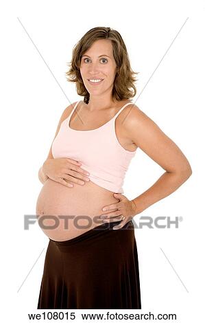 Stock Photography - Caucasian woman who is 9 months pregnant on white background. Fotosearch