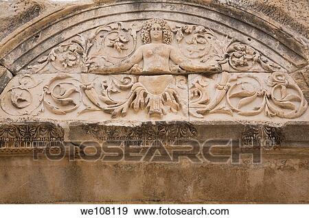 Close-up of a figurine on an archway at the ancient ruins of Ephesus, Turkey View Large Photo Image Stock Photo - Close-up of a figurine on an archway at the ancient ruins of Ephesus, Turkey. Fotosearch