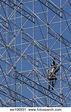 Stock Image - Constructive work builds on a metal stand structure. Fotosearch