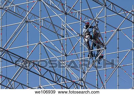Stock Photo - Constructive work builds on a metal stand structure. Fotosearch