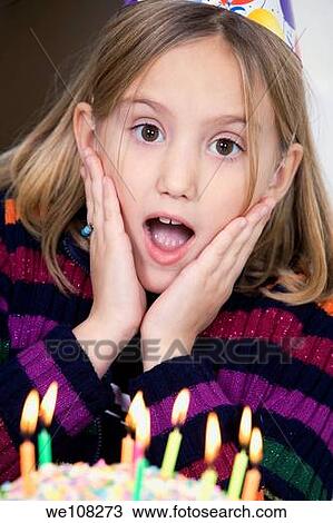 Eight year old girl having a birthday party View Large Photo Image Stock Image - Eight year old girl having a birthday party. Fotosearch