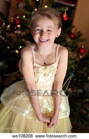 Little girl in a princess costume next to a Christmas tree View Large Photo Image Stock Photo - Little girl in a princess costume next to a Christmas tree. Fotosearch