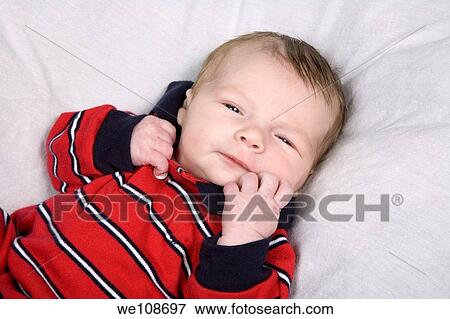 New born baby boy in first photo shoot View Large Photo Image Stock Photo - New born baby boy in first photo shoot. Fotosearch
