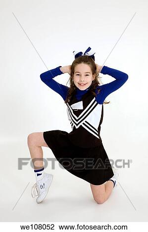 Nine year old girl dressed as cheerleader View Large Photo Image Stock Image - Nine year old girl dressed as cheerleader. Fotosearch