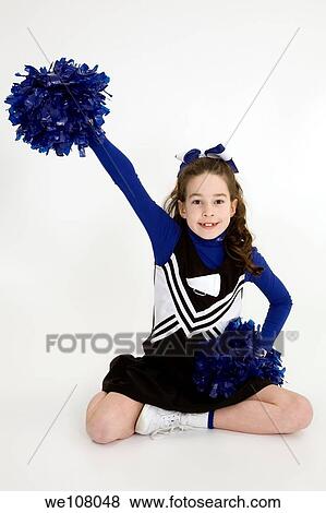 Nine year old girl dressed as cheerleader View Large Photo Image Stock Photo - Nine year old girl dressed as cheerleader. Fotosearch