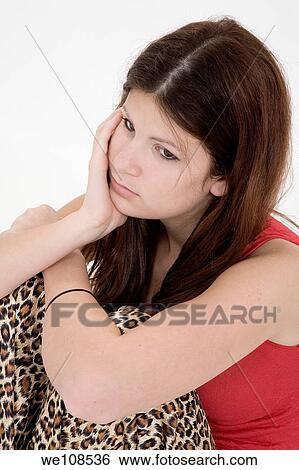 Stock Photograph - Portrait of a depressed teenage girl. Fotosearch