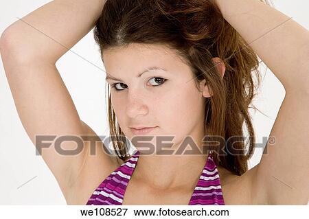 Stock Photo - Portrait of a teenage girl in a swimsuit top. Fotosearch