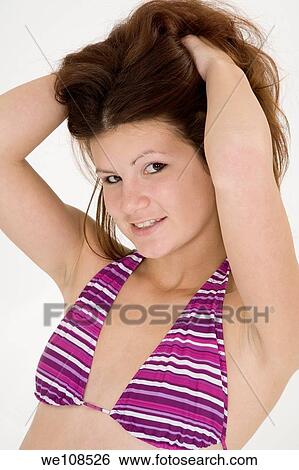 Portrait of a teenage girl in a swimsuit top View Large Photo Image Stock Photograph - Portrait of a teenage girl in a swimsuit top. Fotosearch