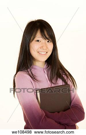 Stock Photo - Portrait of Asian teen getting ready for school. Fotosearch