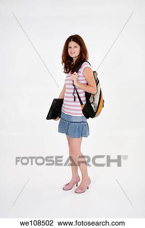 Stock Image - Portrait of Caucasian teen getting ready for school. Fotosearch