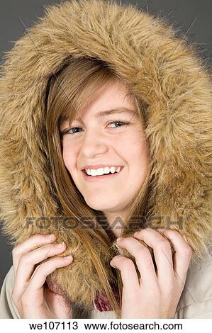 Preteen girl posing on gray background with some attitude View Large Photo Image Stock Image - Preteen girl posing on gray background with some attitude. Fotosearch