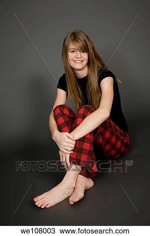 Preteen girl posing on gray background with some attitude View Large Photo Image Stock Image - Preteen girl posing on gray background with some attitude. Fotosearch