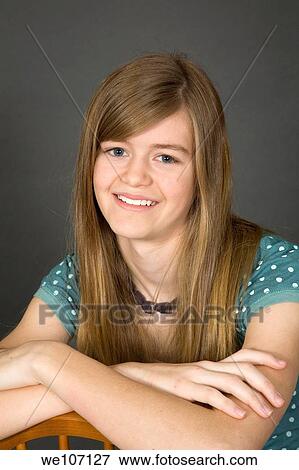 Stock Photo - Preteen girl posing on gray background with some attitude. Fotosearch