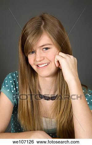 Preteen girl posing on gray background with some attitude View Large Photo Image Stock Photograph - Preteen girl posing on gray background with some attitude. Fotosearch