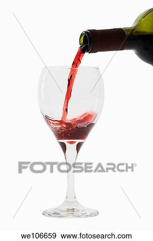 Stock Photo - Red Wine pouring into glass. Fotosearch