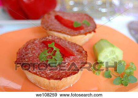 Salami sandwich on kaiser roll decorated with parsley and paprika View Large Photo Image Stock Photo - Salami sandwich on kaiser roll decorated with parsley and paprika. Fotosearch
