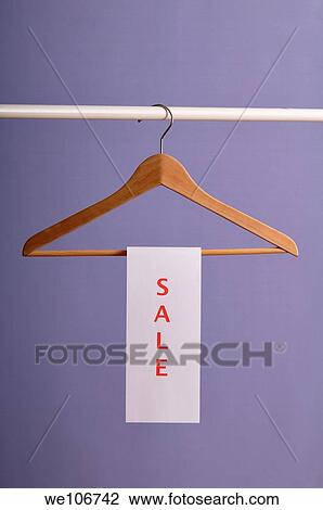 Sale sign on hanger View Large Photo Image Stock Image - Sale sign on hanger. Fotosearch