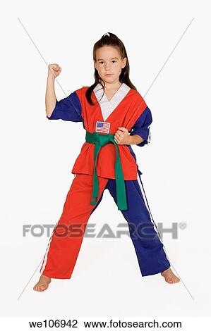 Stock Image - Seven year old practicing Martial Arts. Fotosearch