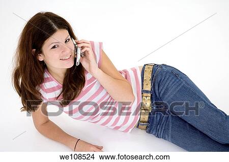 Teen talking on the cell phone View Large Photo Image Picture - Teen talking on the cell phone. Fotosearch