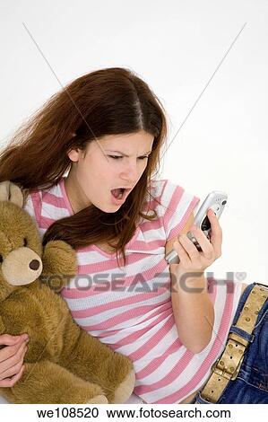 Teen talking on the cell phone View Large Photo Image Stock Image - Teen talking on the cell phone. Fotosearch