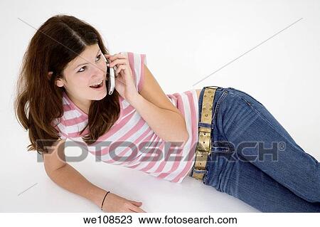 Teen talking on the cell phone View Large Photo Image Stock Image - Teen talking on the cell phone. Fotosearch