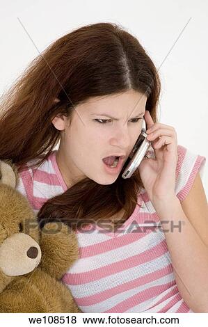 Teen talking on the cell phone View Large Photo Image Stock Photo - Teen talking on the cell phone. Fotosearch