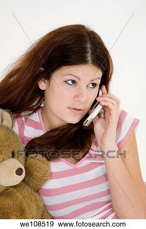 Stock Photo - Teen talking on the cell phone. Fotosearch