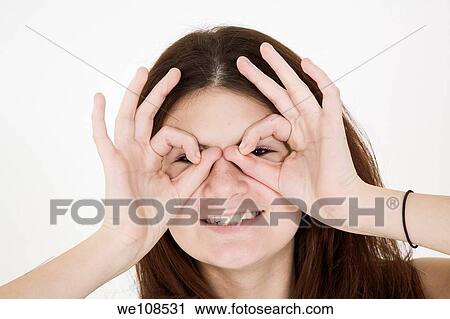 Teenage girl acting silly with hand gusters View Large Photo Image Stock Image - Teenage girl acting silly with hand gusters. Fotosearch