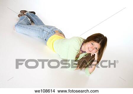 Teenage girl posing on a white background View Large Photo Image Picture - Teenage girl posing on a white background. Fotosearch