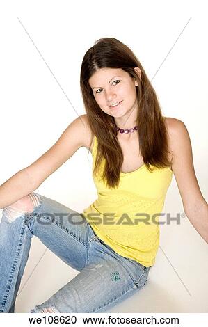 Teenage girl posing on a white background View Large Photo Image Stock Image - Teenage girl posing on a white background. Fotosearch