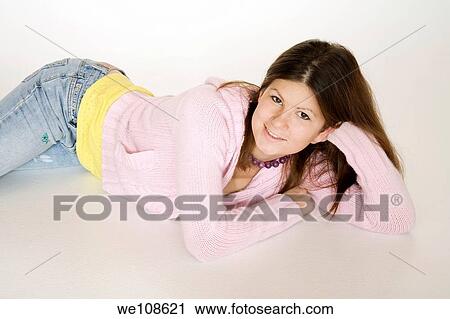 Teenage girl posing on a white background View Large Photo Image Stock Image - Teenage girl posing on a white background. Fotosearch