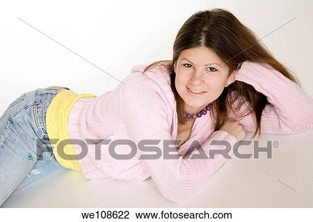 Teenage girl posing on a white background View Large Photo Image Stock Image - Teenage girl posing on a white background. Fotosearch