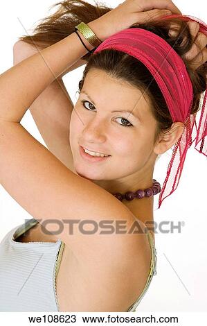 Teenage girl posing on a white background View Large Photo Image Stock Image - Teenage girl posing on a white background. Fotosearch